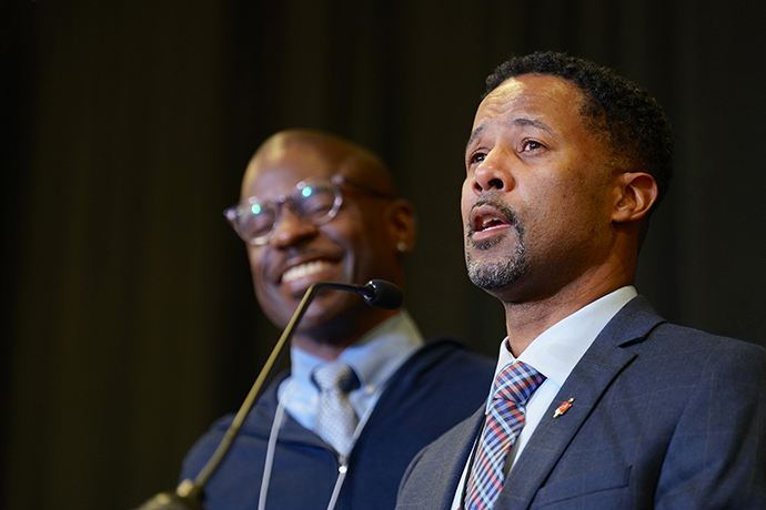 Bishop Cedrick Bridgeforth addresses the delegates, guests, and his new episcopal colleagues, shortly after his election. His husband, Christopher Hucks-Ortiz, stands at his side. Photo by Patrick Scriven (PNW) for the WJ.