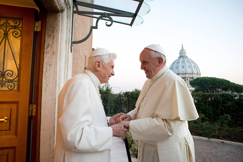 Pope Francis greets retired Pope Benedict XVI at the retired pontiff's Vatican residence Dec. 23, 2013. (OSV News photo/Vatican Media)