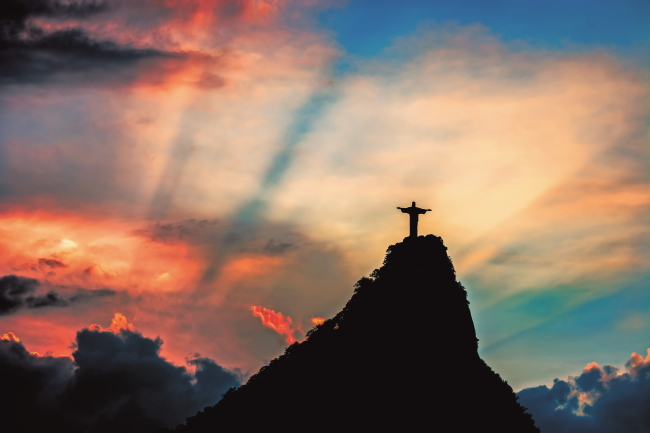 Christ the Redeemer, Cristo redentor at sunset, in Rio de Janeiro - Brazil
